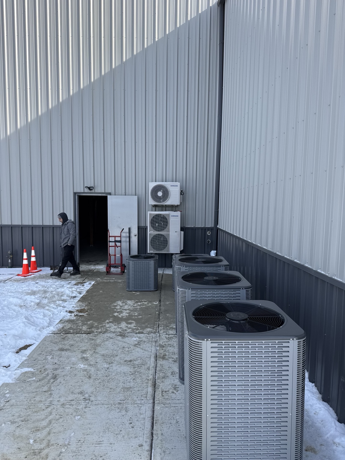 Commercial HVAC equipment lineup with GE condensers and Samsung systems