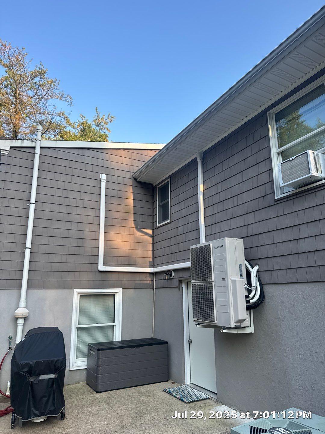 Samsung multi-zone ductless outdoor system mounted beside a home